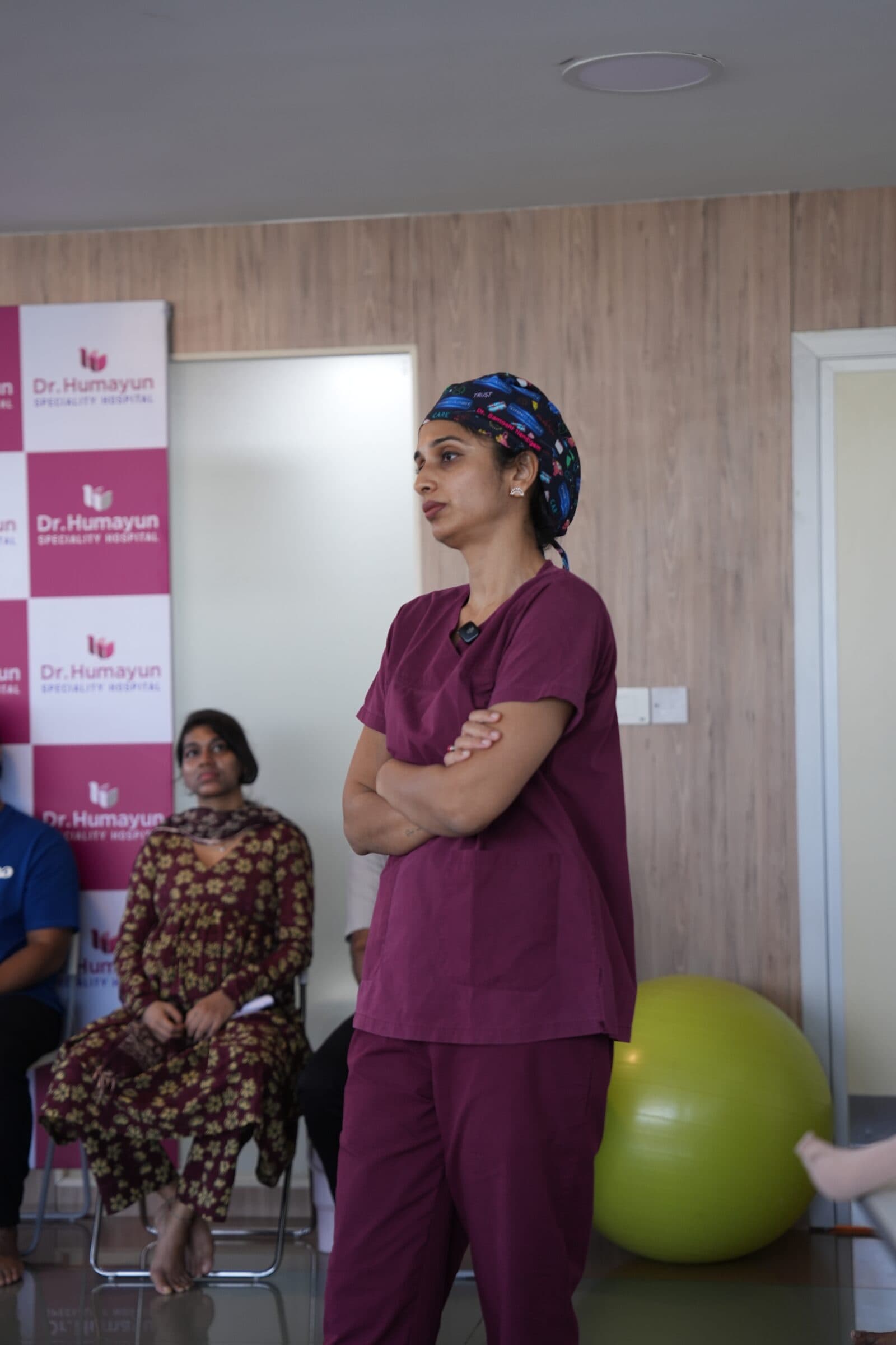Doctor listening to families at a prenatal workshop