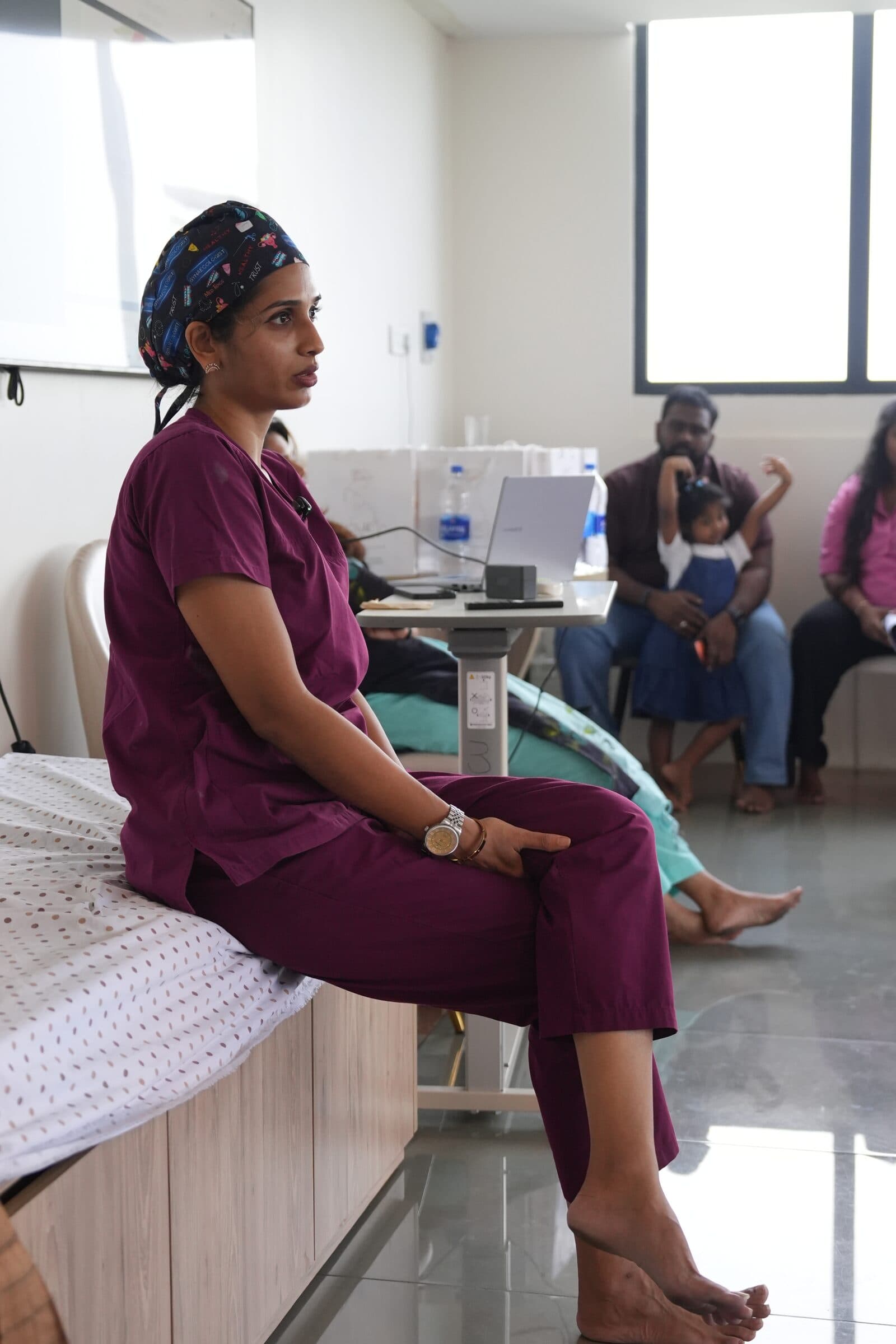 Childbirth educator speaking with families during a prenatal workshop.